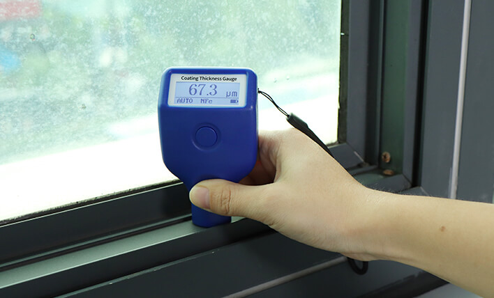 86220H Coating Thickness Gauge tests the coatings on aluminum window sill